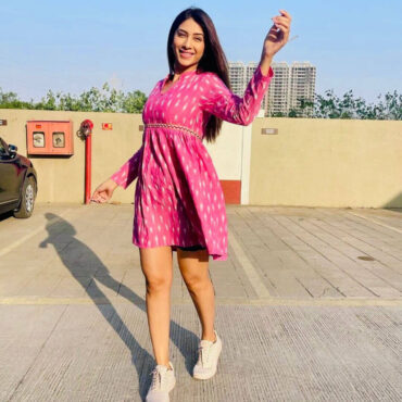 Modern ethnic pink ikat dress with fit-and-flare cut , cotton fabric, side pockets , full sleeves, and collared neck for everyday comfort .