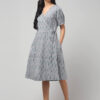 Coin grey Ikat wrap dress with teal patterns, waist tie, and pockets made in 100% cotton.