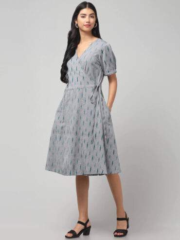 Coin grey Ikat wrap dress with teal patterns, waist tie, and pockets made in 100% cotton.