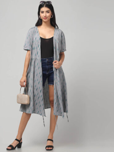 Grey ikat Cotton wrap dress with short sleeves, tie-up waist, pockets, and knee-length flare by Abravi.