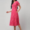 Pink Ikat midi dress with V-neck wrap style and handloom cotton texture.