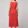 Indian woman wearing coral red Ikat handloom A-line maxi dress made with 100% cotton with 2 functional pockets.