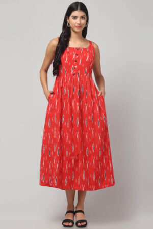 Coral woven Ikat maxi dress on model showing sleeveless neckline and flared hem