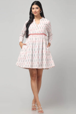 Ikat mini dress with Handcrafted waistband embroidery, long sleeves, and soft cotton fabric texture