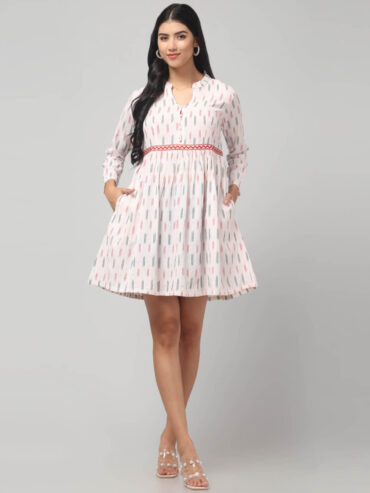 Ikat mini dress with Handcrafted waistband embroidery, long sleeves, and soft cotton fabric texture