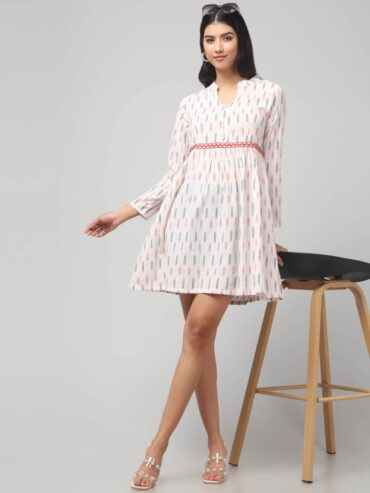 Handloom Ikat cotton mini dress with mandarin notch neckline, red embroidered waist and flared hem.