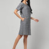 Indian female model wearing Pochampally handloom Ikat pure cotton knee length shift dress with two pockets and short sleeves.