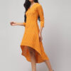 Side angle of High-low hemline detail of Yellow Ikat handloom featuring soft drape and airy movement by Abravi, New Delhi based women's clothing label.