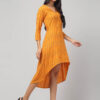 Side angle of Yellow Ikat Hi-Low Dress highlighting the flowy flare, breathable Ikat cotton and high-low silhouette from Abravi Indian sustainable clothing brand by woman.