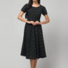 Indian female model showcasing swadeshi handmade charcoal black Ikath cotton fit and flare midi dress for local bharat