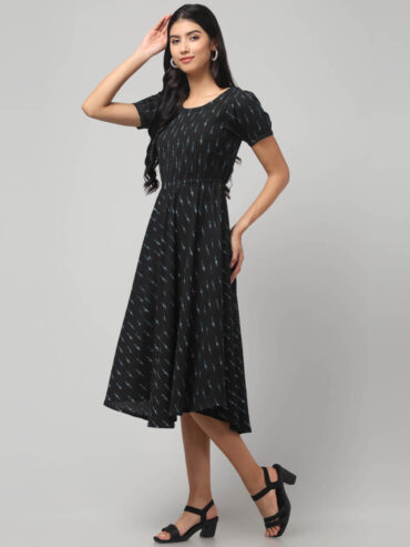 Indian female model wearing charcoal black eco friendly handloom Ekat pure cotton midi dress with puff sleeves