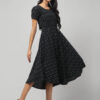 Indian model wearing charcoal black cotton hi-low dress for women and girls with short puff sleeves and empire waist by Abravi India.