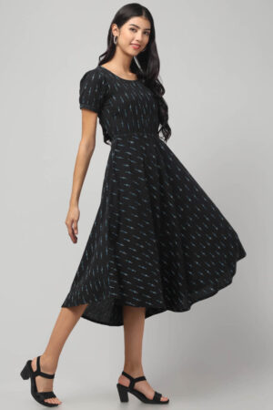 Indian model wearing charcoal black cotton hi-low dress for women and girls with short puff sleeves and empire waist by Abravi India.