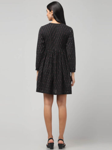 Ethnic-inspired black Ikat short dress with pockets, soft sustainable handloom fabric, festive styling.