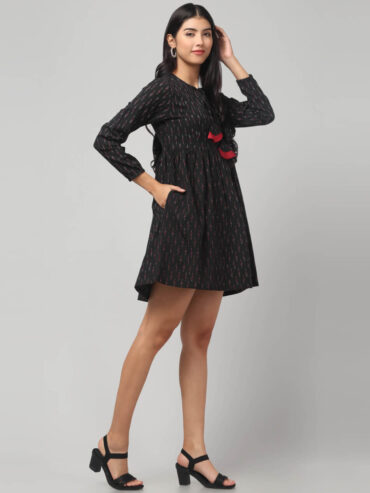 Handloom black Ikkat Flare knee length dress with full sleeves and tassel tie on neck, comfortable everyday wear for all age group women.