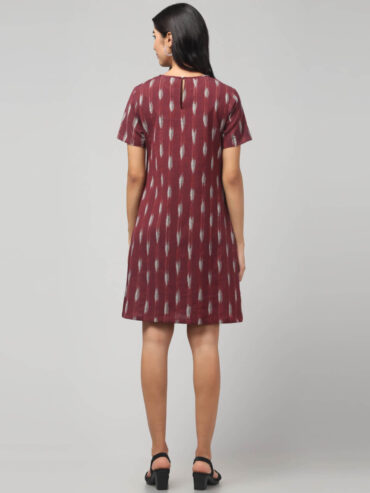 Back of the dress women styling rosewood maroon Ikat pure cotton knee length dress with side pocket.