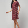 Indian model showcasing rosewood Ikkat handloom cotton fabric pattern on women dress