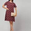 Indian women wearing rosewood maroon handloom Ekat cotton knee length dress with side pocket.