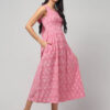 Left side view of Abravi Carnation Pink handloom cotton Ikat dress with back bow -tie details.