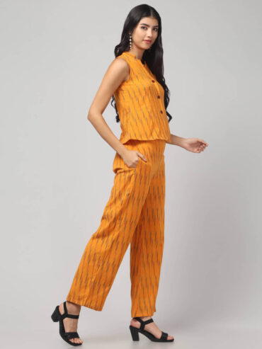 Indian model wearing the sunny zest chorme yellow Ikath Cotton co-ord set with two side pockets for women and gilrs by Abravi India