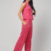 Indian model wearing candy floss pink ikat cotton co-ord set with sleeveless pochampally handloom top and pants