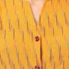 close view of chorme yellow Ikat handloom cotton co-ord set for women with sleeveless top and straight pants by Abravi - India