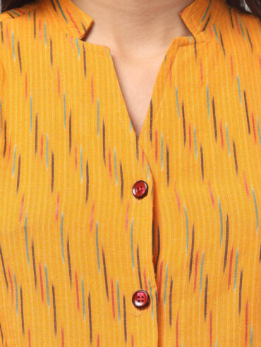 close view of chorme yellow Ikat handloom cotton co-ord set for women with sleeveless top and straight pants by Abravi - India