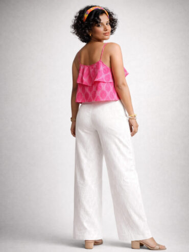 Back view of a pink Ikat handloom cotton crop top and white pants on an Indian female model, showing rear fit and detailing by Abravi India Handlooms.