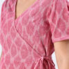 close up of pink handloom Ikat wrap dress for Indian women, handcrafted sustainable ethnic wear.